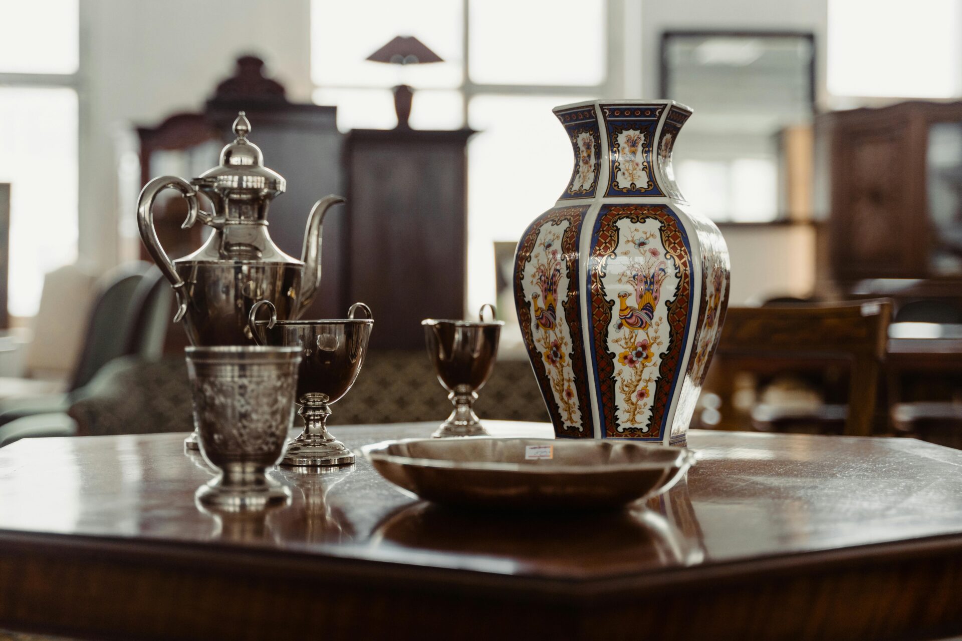 Chicago antique appraisers evaluating fine art porcelain vases, estate silver tea services, and decorative arts.